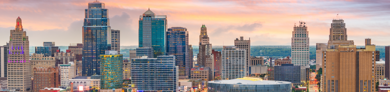 Skyline image of Kansas City buildings at sunset